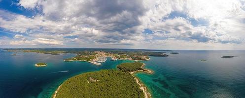 Aerial panoramic drone picture of Vrsar harbour in Croatia with turquoise water during daytime photo