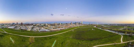 Panoramic aerial drone picture of Dallas skyline and Trammel Crow Park at sunset in winter photo