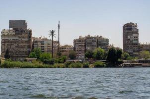 slum houses of Cairo on the banks of the Nile in Egypt photo