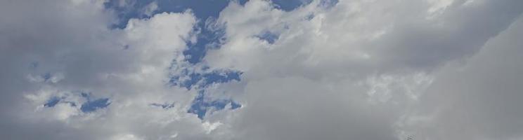 Image of a partly cloudy and partly clear sky during the day photo