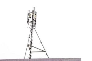 communication tower with antennas on the top of building isolate on white background photo