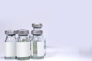 injectable drug bottles on white background. photo