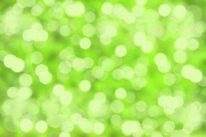 Abstract white and light green bokeh with blur reflection lighting on green color background. photo