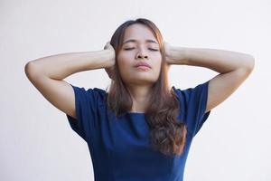 Asian women suffer from work stress. Put your hand on your head photo