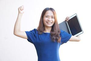 Businesswoman looking at a portable computer monitor Glad to have more profit photo