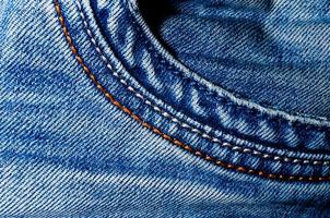 texture pocket of blue crumpled jeans macro closeup photo