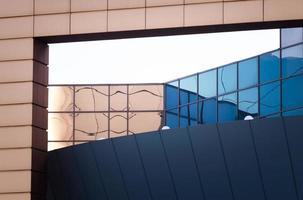 fragment of the wall of a modern blue building on a white background photo