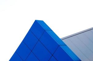 fragment of the wall of a modern blue building on a white background photo