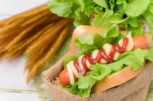 Food menu Sausage wrapped in bread photo