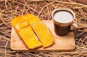 Buttered Bread with warm cow's milk photo