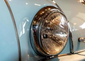 retro car headlight close up photo