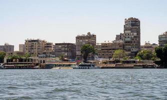 slum houses of Cairo on the banks of the Nile in Egypt photo
