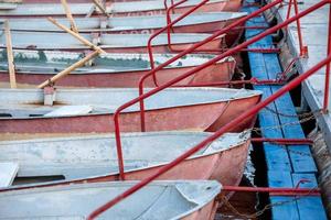 several old boats near the pier photo