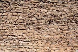 pattern old wall made of natural stone photo