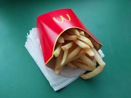 KYIV, UKRAINE - JANUARY 15, 2023 Food from McDonald's Big Mac with potatoes photo