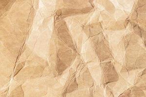 Brown crumpled paper texture background photo