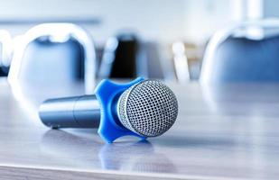 Close up microphone on table in seminar room. photo