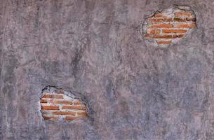 Loft style cement wall with crack and orange brick photo