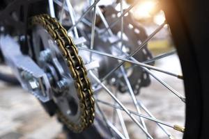 motorcycle chain on a wheel close-up photo