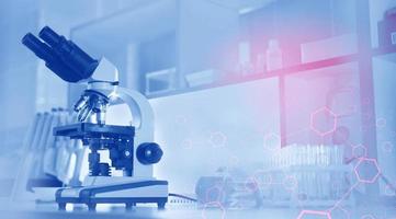 microscope and test tubes on the background of the laboratory. photo