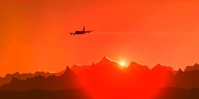 silueta de un avión de pasajeros contra el fondo de la puesta de sol y las montañas foto