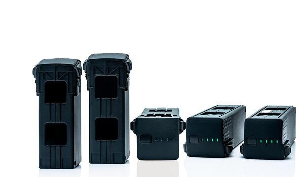 Drone LiPo battery on white background. Rechargeable battery of drone aircraft with digital camera. Lithium polymer battery used to power UAV. Lithium-ion technology using a polymer electrolyte. photo