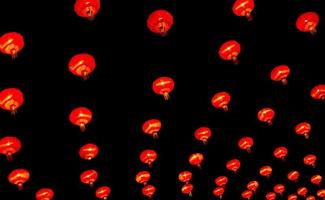 Chinese lantern in new year festival, red lanterns are hung as pattern,black background,Chinese new year concept. photo