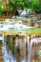 Amazing colorful waterfall in national park forest during spring,beautiful deep forest in Thailand,technic long exposure, during vacation and relax time. photo