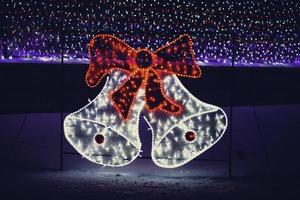 Christmas Lights in the form of bells and a bow. photo