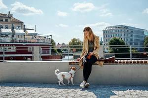 Woman walks with dog photo