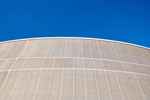 Modern building detail against blue sky. Abstract architecture background photo