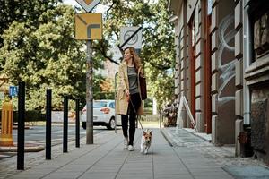 Woman walks with dog photo