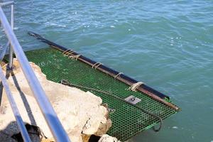 Berth on the seashore for mooring boats and yachts. photo