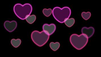 Animation pink heart shape floating on black background. video