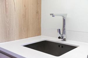 stainless steel kitchen sink in room photo