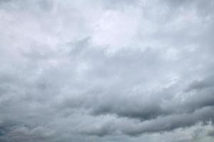 White and grey clouds scenic nature environment background. Storm clouds floating in a rainy day with natural light. Cloudscape scenery, overcast weather above blue sky. photo