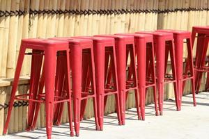 Chair and table in a cafe in a city park near the sea. photo