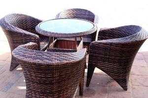 Chair and table in a cafe in a city park near the sea. photo