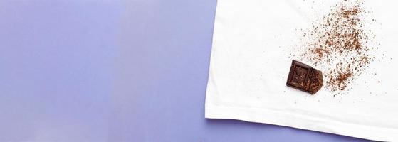 white clothes with ditry stains from chocolate on purple very peri background photo