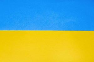 paper ukrainian flag background. Blue and yellow color photo