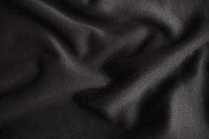 black wrinkled plush fabric background texture, soft material pattern photo