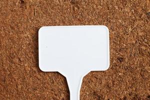 soil texture close up. mock up. coconut briquette with writing boards photo