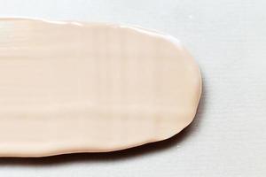 liquid tone foundation texture background. Makeup Concept photo