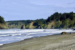 waves breaking on the rugged Oregon coast photo