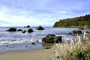 waves breaking on the rugged Oregon coast photo