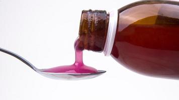 Concept Pouring Liquid Medication, Medicine Syrup Bottle