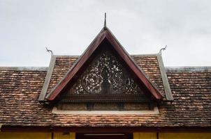 Antique Ceramic Roof of Porch's Gate of Wat Sisaket Monastery at Vientiane Capital City of Laos photo