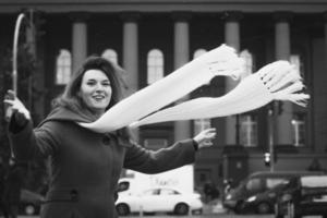 Close up funny lady with flowing scarf on street monochrome portrait picture photo