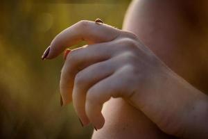 Close up woman holding ladybug on finger concept photo