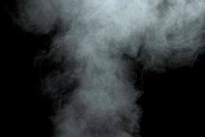 Abstract  powder or smoke isolated on black background photo